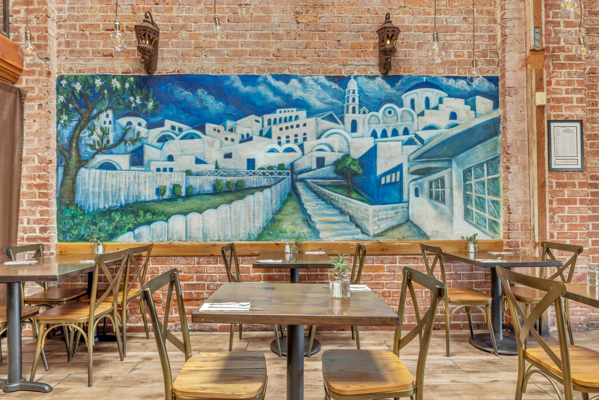 Dining-room tables beside George’s blue island mural