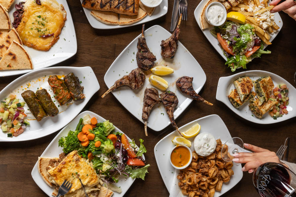 Greek dishes shared around the table